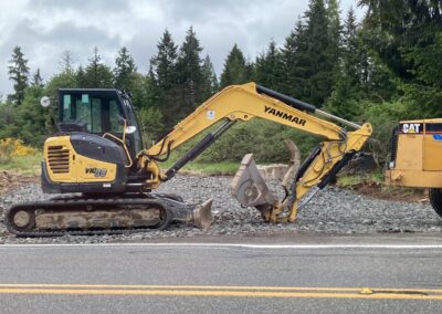 Road builder bucket at road project