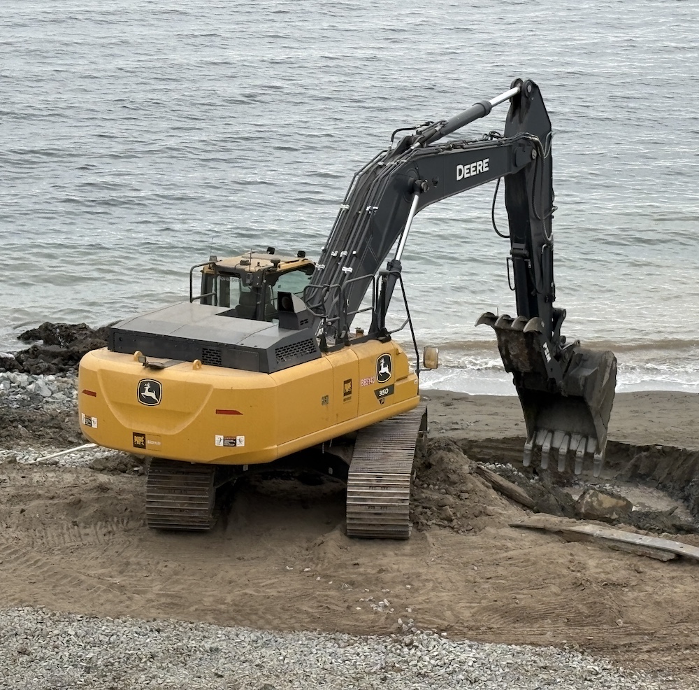 Orange bucket attachment for heavy machinery