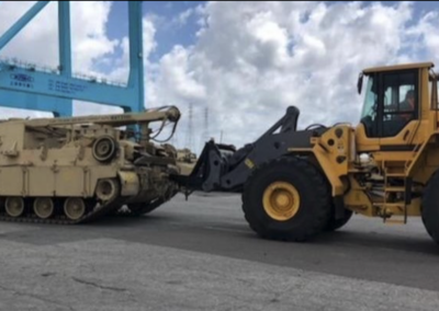 Wheel loader jib boom moving a tank