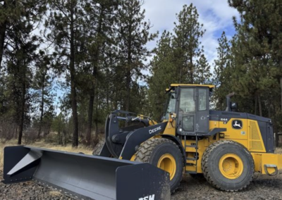 Ramp plow used for smoothing gravel in forest